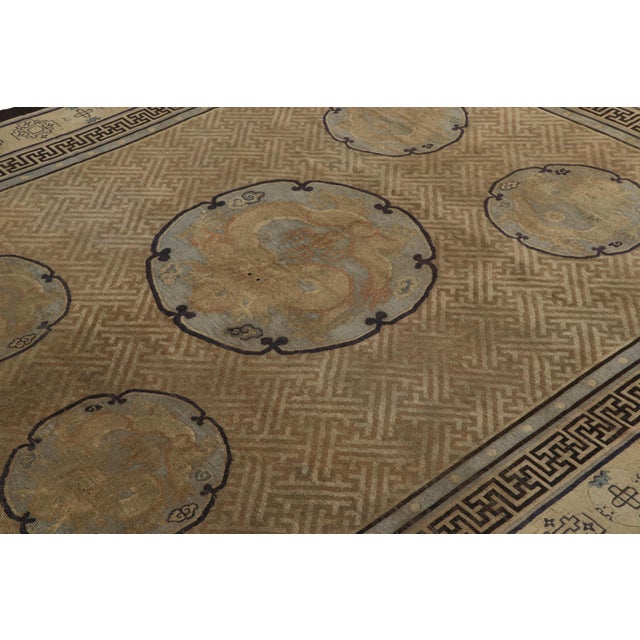 Hand-knotted in wool circa 1890-1900, this 8x9 antique Chinese rug is an exceptionally rare curation from the Rug & Kilim...