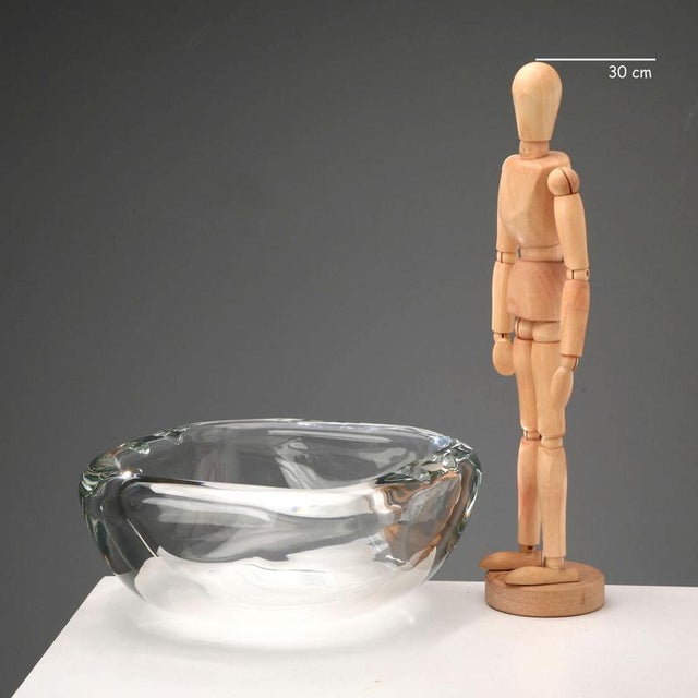 Colorless glass ashtray made by Barbini. Signature under the base. This piece is attributed to the mentioned...