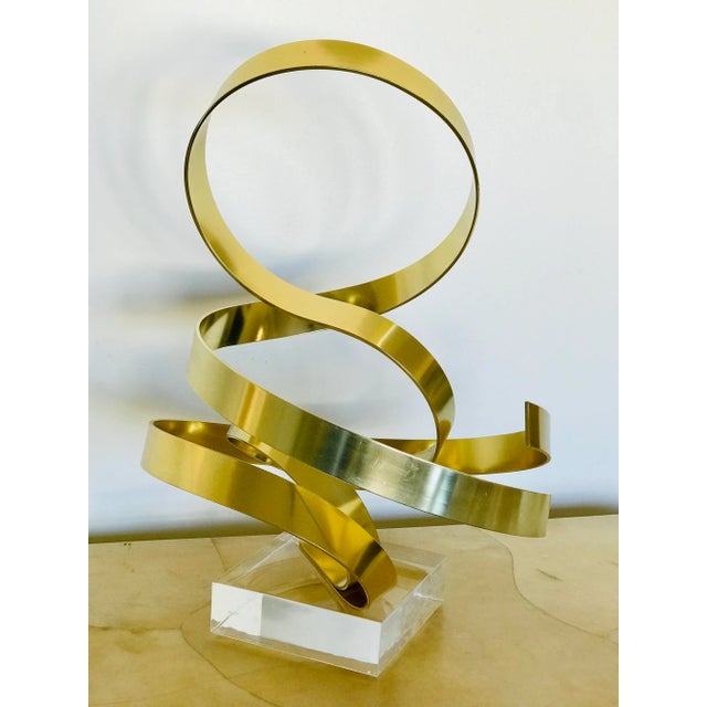 A signed and dated sculpture by American artist Dan Murphy. Inscribed on lower section “Dan Murphy 1986”. Gold tone...