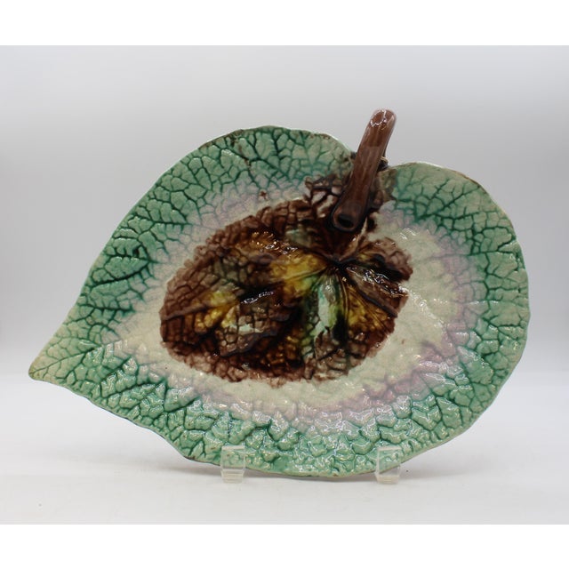 Circa 1880 English majolica begonia leaf serving tray. Vine loop handle. Green to soft lilac to green, brown & yellow...
