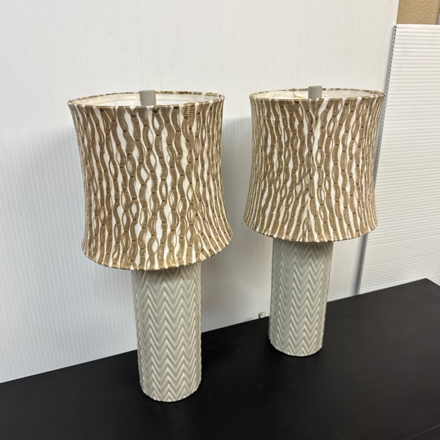 Design Plus Gallery presents a Pair of Ceramic Table Lamp with a Celadon Shade Ceramic Bases. This pair is entirely...