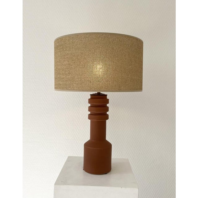 Terracotta-style glazed ceramic table lamp, France, circa 1990. with its modern style, this timeless lamp will fit...