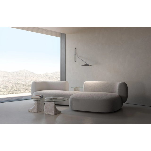 Hug sofa is defined by clean, simple lines and a distinctive armrest detail. The armrest, half overlapping the seat...