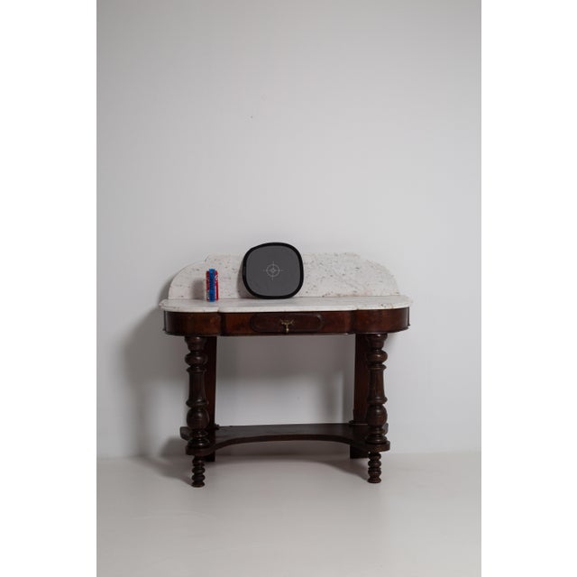 A rare and refined example of Victorian craftsmanship, this console table from 19th-century Britain speaks to an era when...