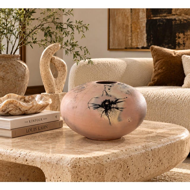 Striking 1986 studio pottery vase by Richard Mahaffey, featuring a sculptural rounded form with a small circular opening....