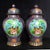 A striking large pair of Chinese Cloisonné Enamel "General Jars." These vibrant vessels feature a central panel of...