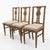 A set of three Neoclassical Revival dining chairs, Continental European, early twentieth century. Each back is built...