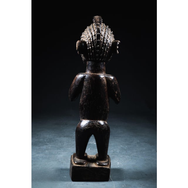 A symbol of fertility and protection, the Nimba figure is traditionally associated with fertility rites and agricultural...