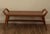 Beautiful Cove-style bench attributed to Union Home, featuring a recycled teak frame with a tightly handwoven brown...