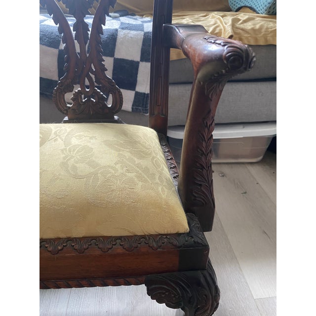 This gorgeous and high quality antique Victorian mahogany Chippendale-style children's loveseat from the late 19th to...