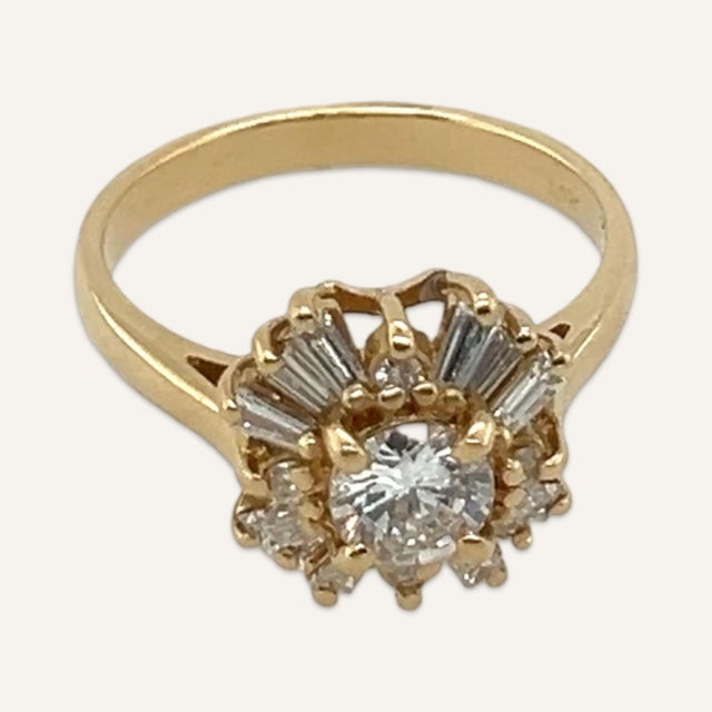 Lady’s diamond starburst engagement ring in 14k yellow gold. Stamped 14k, this ring features 8 tapered baguettes at 2.8mmx...