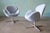 A pair of Swan Chairs designed by Arne Jacobsen for Fritz Hansen newly upholstered in a baby blue nubby boucle fabric....