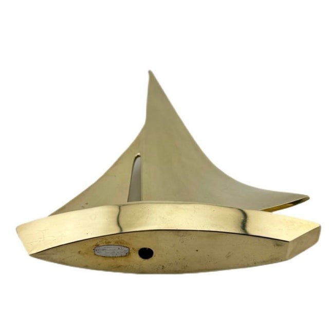 Vintage Dolbi Cashier solid brass nautical sailboat. This lovely piece of retro decor measures 10 inches in height, 7...
