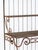 This circa 1930 French wrought iron étagère has a graceful, architectural presence defined by ascending shelves, curved...