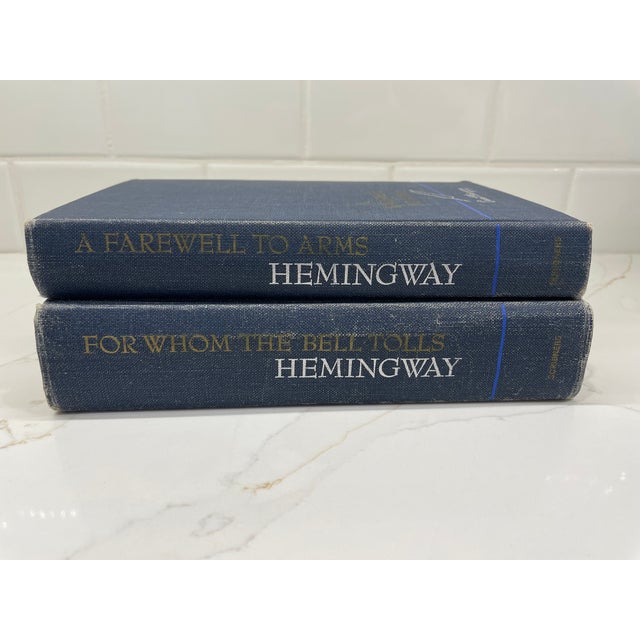 Just sublime. For Whom the Bell Tolls and A Farewell to Arms by Ernest Hemingway. Beautiful blue fabric with titles in...
