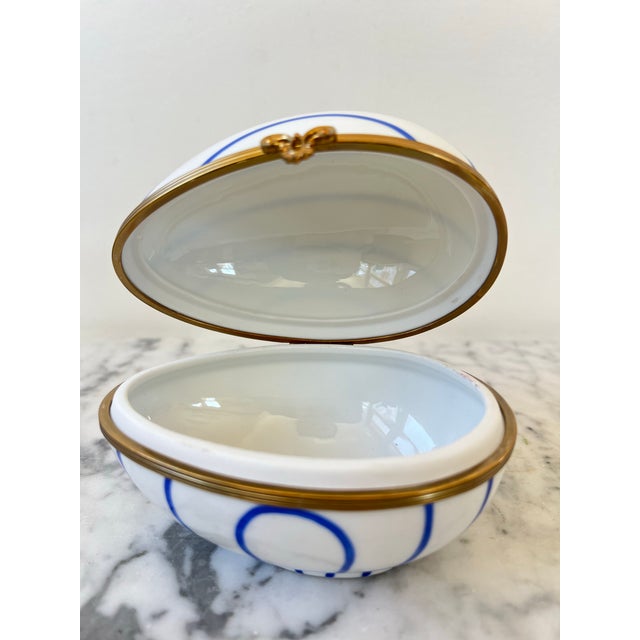 Lovely pair of Lamo’s friends hand painted porcelain egg jewelry or trinket boxes. Made in France