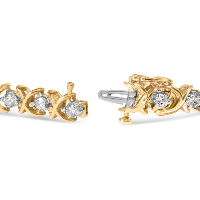 Introducing a dazzling masterpiece that will leave you breathless - a 14K Yellow Gold Bracelet adorned with a mesmerizing...