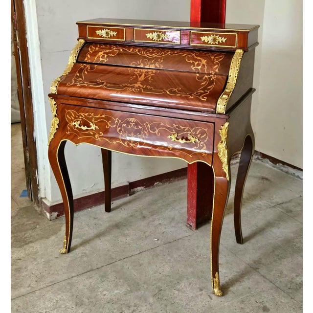 Bring timeless French elegance into your home with this exquisite Louis XV-style roll top secretary desk. Crafted with...