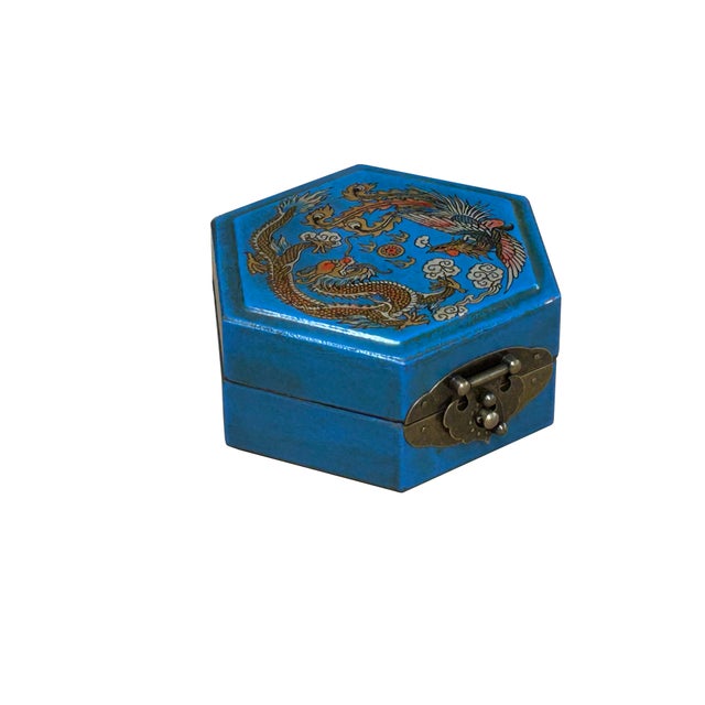 This hexagonal accent box features a vibrant cerulean blue exterior, finished with a textured vinyl wrap that gives it a...