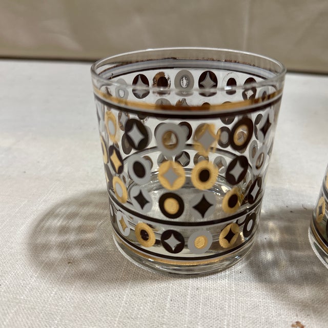 Up for consideration is a beautiful pair of gold, black, and white lowball glasses. These would look lovely in your home...
