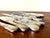 Set of 12 knives from the 1960s, stainless steel blades, silver-plated metal handles with floral and plant motifs. Sold in...