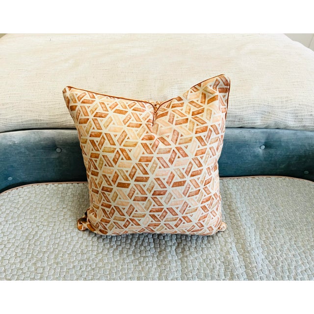Abstract pillow cover from Pepe Penalver in various shades of orange: from blushy peach to deep rusty tones. Measures 18”...