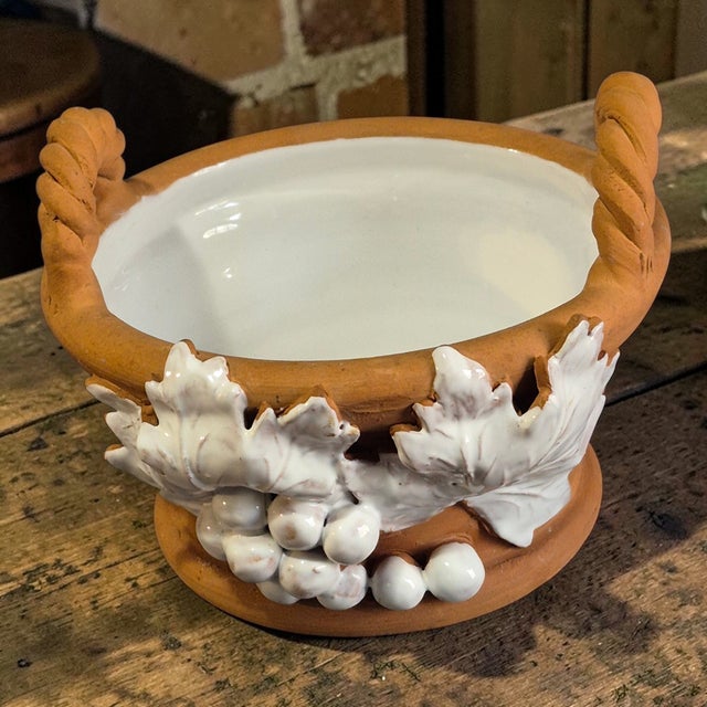 This Vintage Italian Hand Decorated White Grapes Glazed Terra-Cotta Basket Planter by IL Laboratorio Italiano is a...