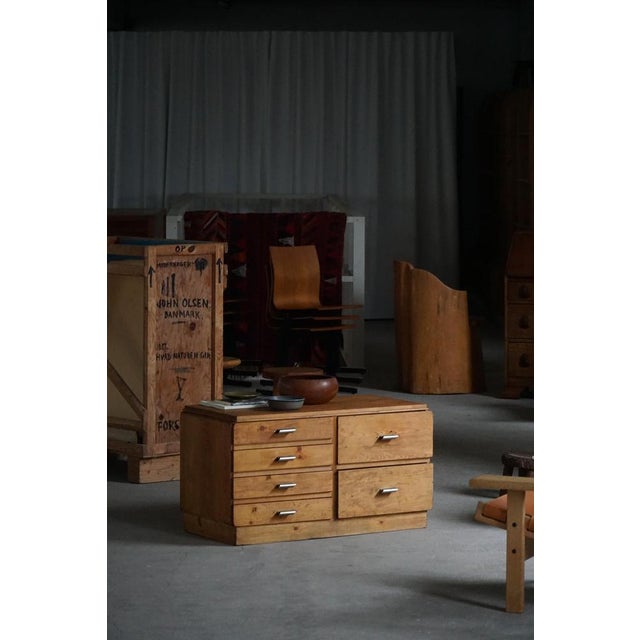 Presenting a charming Danish Art Deco chest of drawers dating from the mid-20th century. Crafted from pine, this piece...