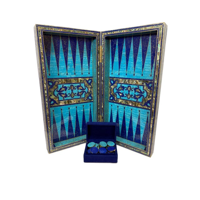 Dual-purpose design featuring a backgammon board inside and a chess board on the exterior. This exquisite handmade wooden...