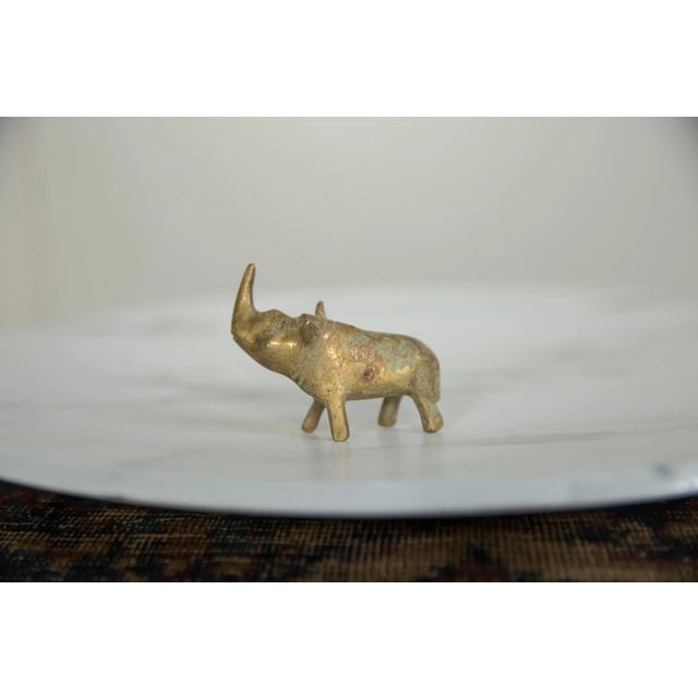 :: Vintage handmade African bronze rhino with golden patina. Circa mid 20th century and possibly older, this piece has...