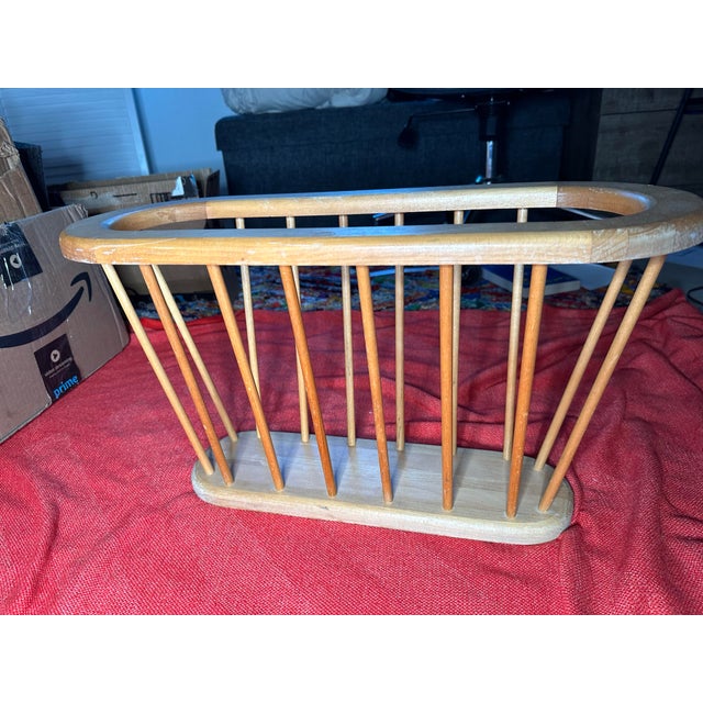 This Arthur Umanoff Style Danish Wood Spindle Magazine Rack / Record Holder is a stylish and functional piece likely from...