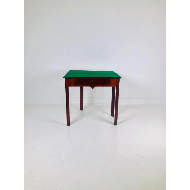 An early 19th-century German Biedermeier mahogany tea table with one drawer, circa 1820. Measures 28.5" h x 30" w x 14.75"...