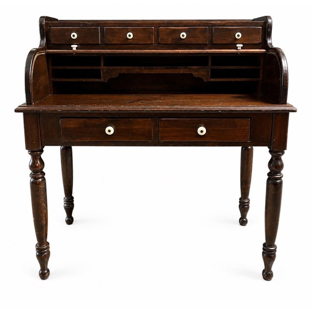 Wonderful vintage Ethan Allen Old Tavern pine rolltop desk. It is in very good vintage condition, with some light signs of...