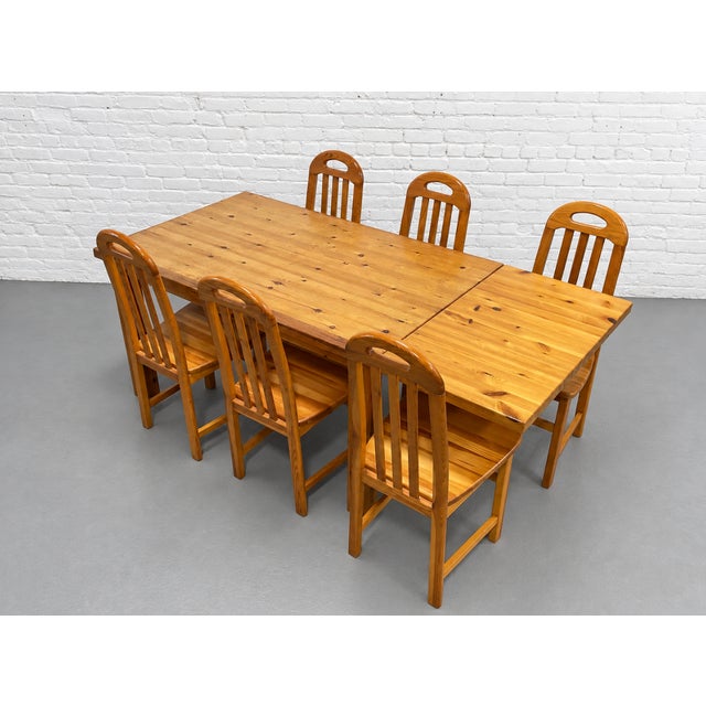 Mid Century Modern Scandinavian solid pine dining table, c. 1970’s. A rectangular top rests on chunky square legs, with...