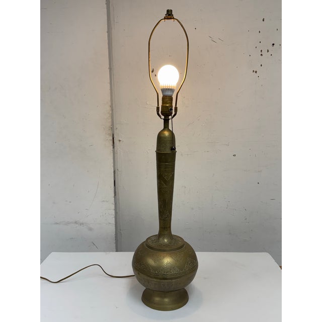 Design Plus Gallery presents a Vintage Etched Brass Table Lamp. The tall, slender stem rises from a rounded base, all...