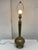 Design Plus Gallery presents a Vintage Etched Brass Table Lamp. The tall, slender stem rises from a rounded base, all...