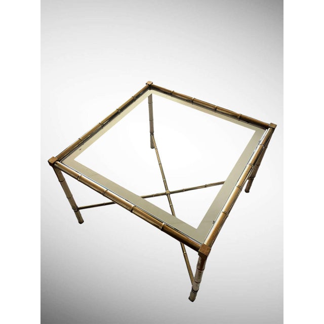 Stylish and elegant french brass ‘faux bamboo’ coffee table, original glass top with a mirrored border.
