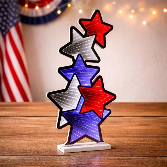 Add a bold burst of patriotic sparkle to your decor with the Americana Star Stack Ekkolight, a dynamic infinity light...