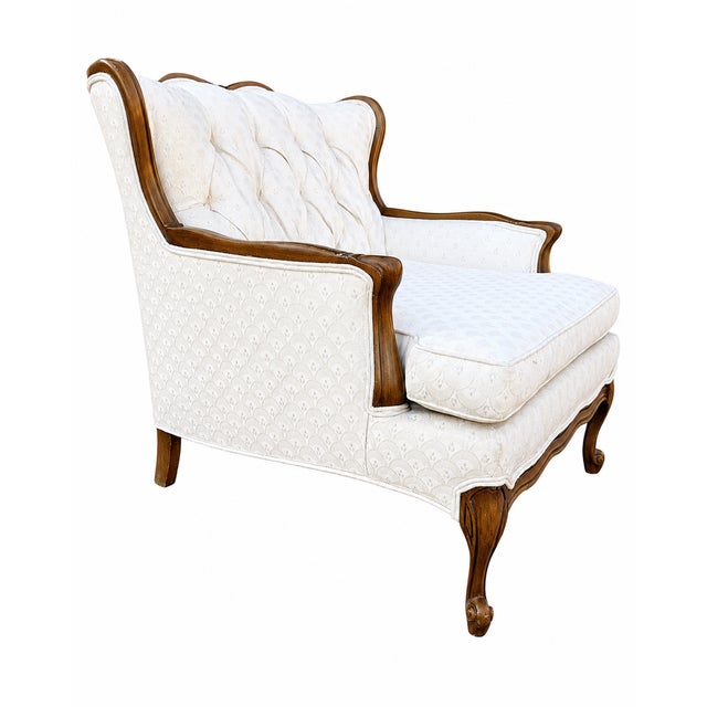 Elegant vintage French Provincial lounge chair attributed to Bassett Furniture, featuring a dramatic scalloped high back,...