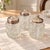 Add sparkle and traditional charm to your table with this matching three-vessel condiment set. The clear glass bodies...