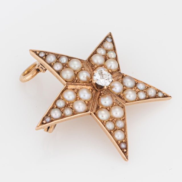 Distinct antique Victorian star pendant (circa 1880s to 1900s) crafted in 14 karat rose gold. One estimated 0.15 carat old...