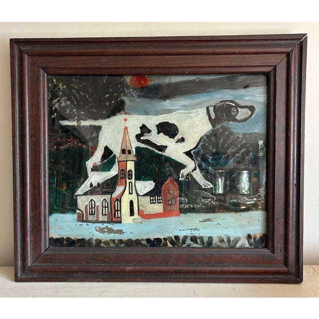 Unique, antique, reverse painted on glass painting of a hunting dog, spaniel, in front of a church. Glass is secured in an...