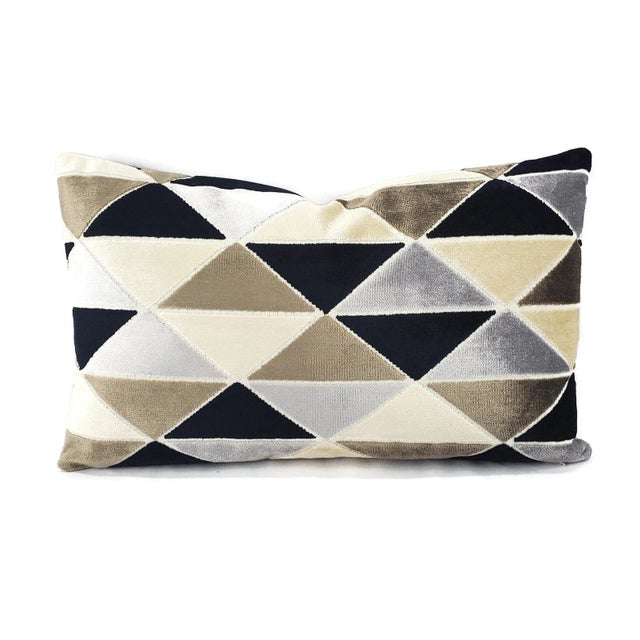 his pillow has black, gray, brown, and cream-cut velvet in a modern geometric diamond pattern. The velvet is super soft...