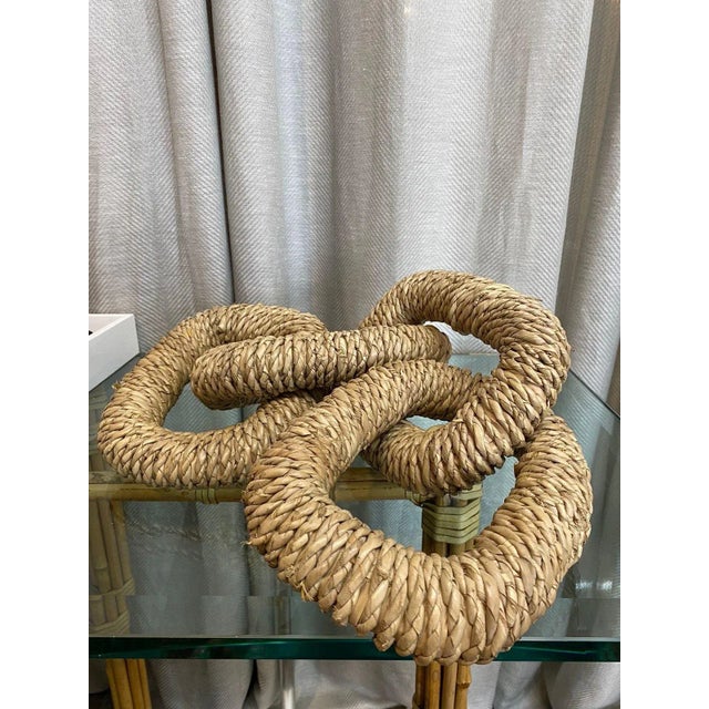 Handmade, oversized natural sisal rope chain decorative object.