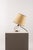 An elegant French Art Deco table lamp, attributed to Jacques Adnet and made around the 1930s. The piece stands out for its...