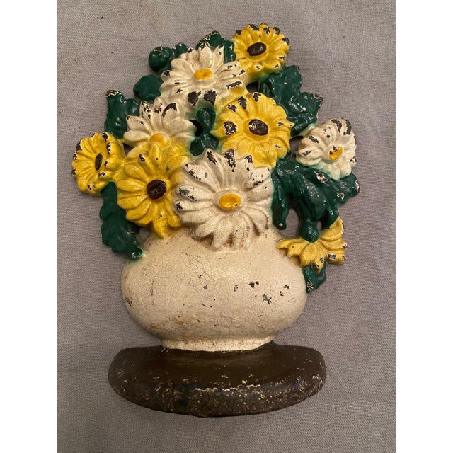 Vintage Cast Iron floral bouquet doorstop no marking on back but is believed to be Hubley manufactured from 1920's-1940's....