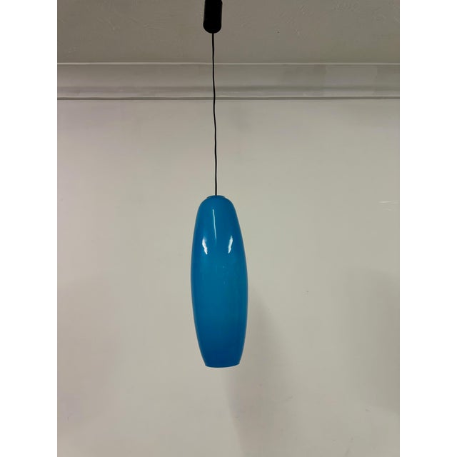 Pendant Blue glass Dimensions include the length of the cable which can be changed Glass shades measures 41cm Italy 1960s...