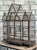 This monumental vintage wire birdhouse has the presence of a small architectural folly. Its iron framework forms a...