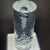 Mesmerizing mid-century cylinder shaped lucite sculpture. For display purposes, this sits on a lighted pedistal that is...