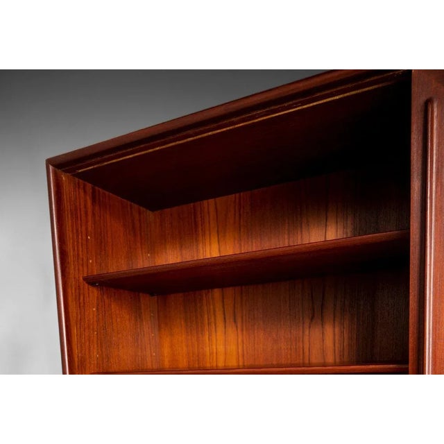 A truly rare and exceptional find designed by Harry Ostergaard, c. 1950s. The cabinet is constructed from teak with large...